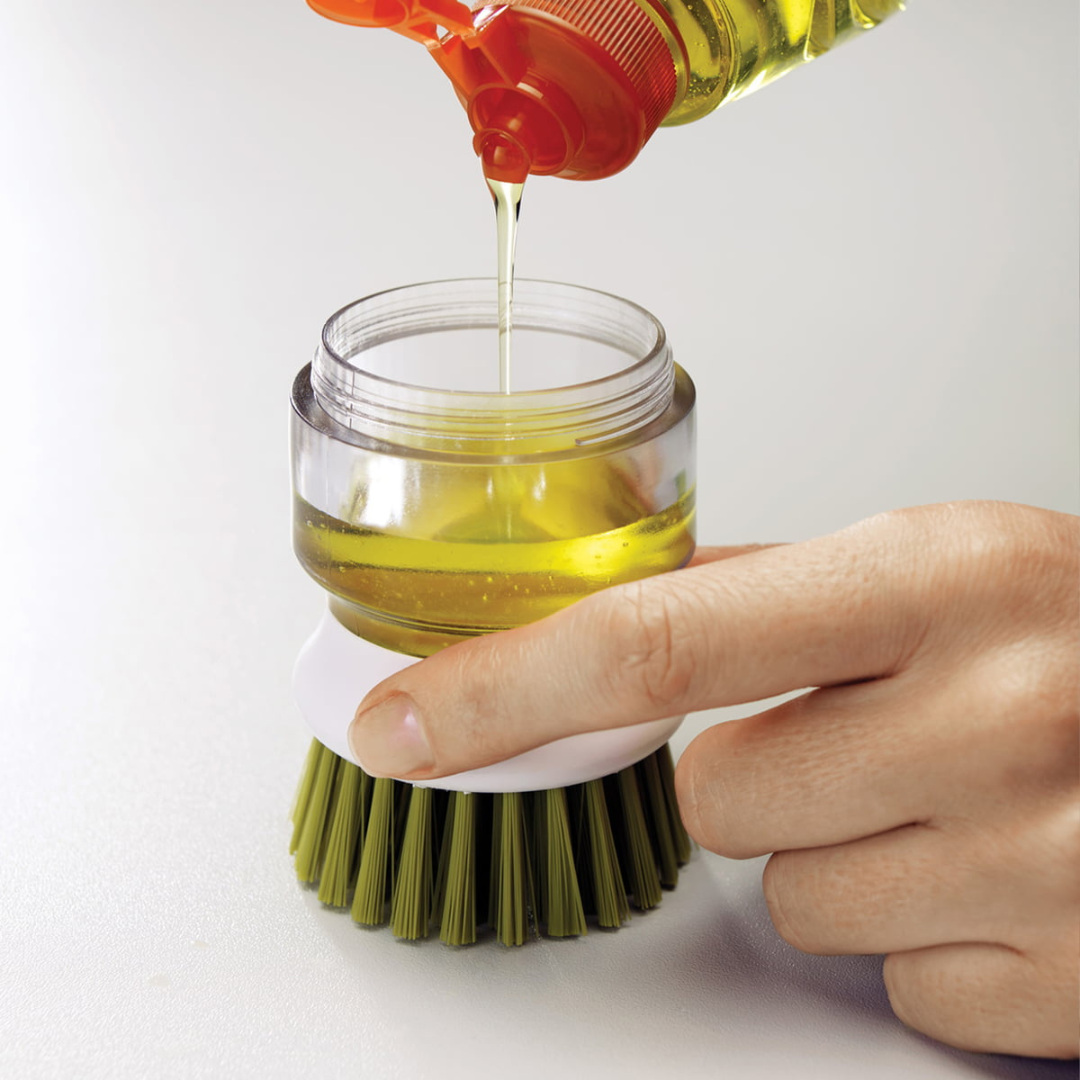 Brosse à vaisselle avec distributeur de savon intégré et support égouttoir