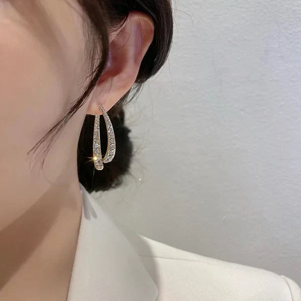 EarGlow™ – Boucles d’oreilles arc audacieuses et remarquables [50% de réduction]