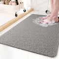 Tapis de douche antidérapant avec système de drainage pour des douches sécurisées