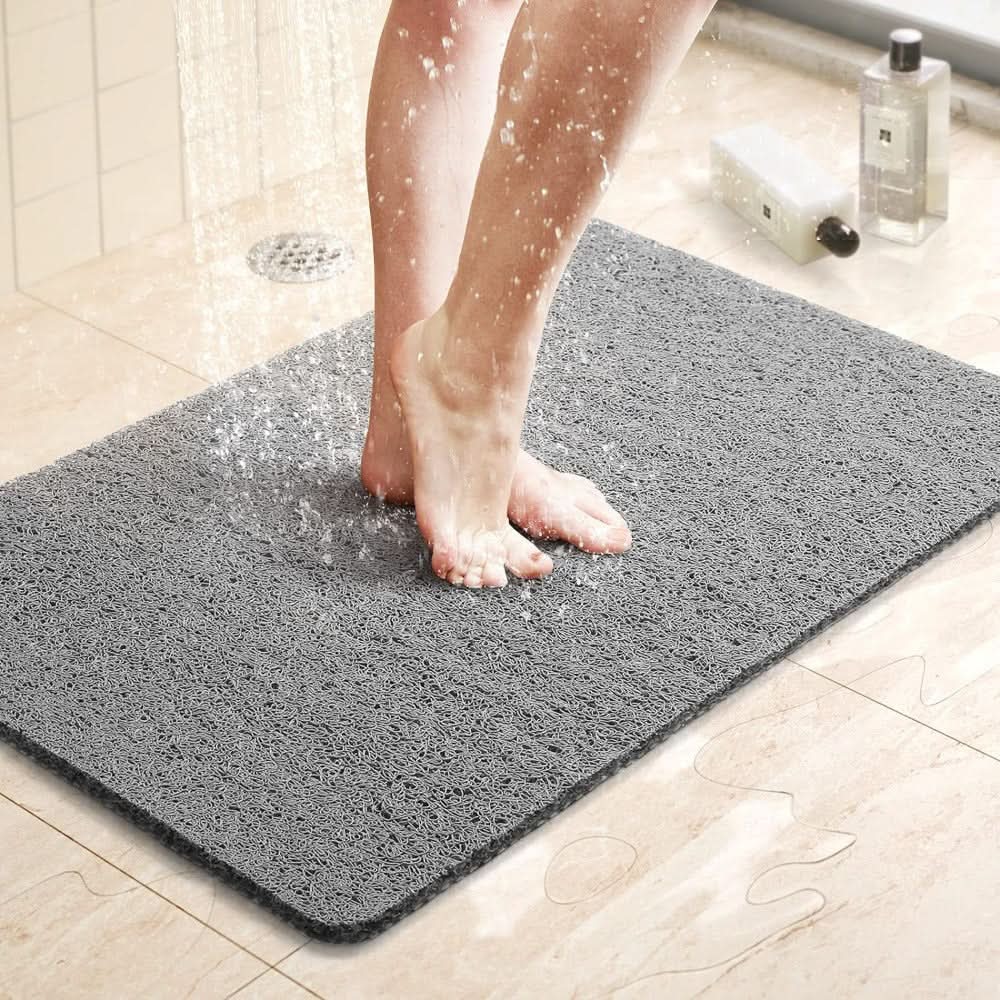 Tapis de douche antidérapant avec système de drainage pour des douches sécurisées