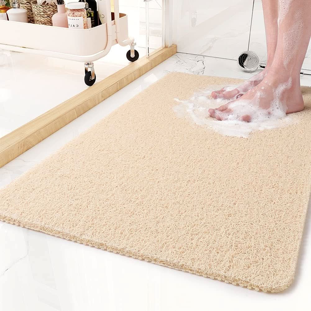 Tapis de douche antidérapant avec système de drainage pour des douches sécurisées