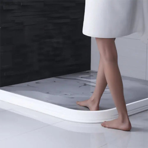 Barrière d'eau flexible auto-adhésive pour sols secs sous la douche