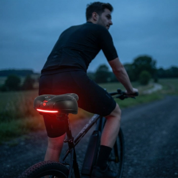 Selle de vélo ergonomique avec rembourrage et bandes réfléchissantes