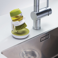 Brosse à vaisselle avec distributeur de savon intégré et support égouttoir